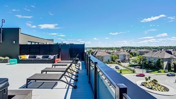 Rooftop terrace with seating and neighborhood views