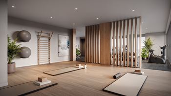 Yoga studio with wooden floors and equipment