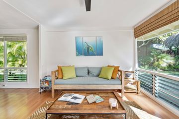 Toronto apartment for rent - A living room with a couch, a coffee table, and a painting on the wall.