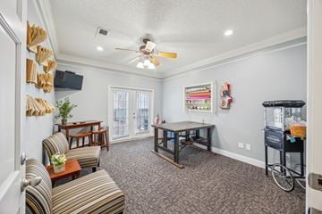 Bedford apartment for rent - A living room with a striped couch and a wooden coffee table.