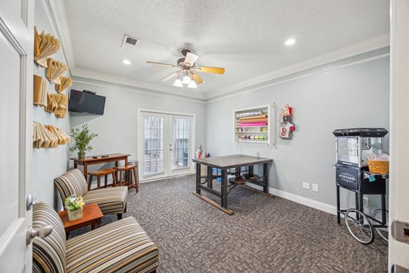 Bedford apartment for rent - A living room with a striped couch and a wooden coffee table.