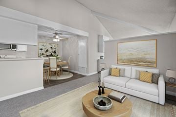 Claremont apartment for rent - A modern living room with a white couch and a painting on the wall.