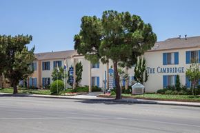 Huntington Beach apartment for rent - An apartment building with blue letters that read "The Cambridge."