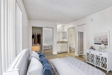 Spring Valley apartment for rent - A white living room with a couch and a mirror.