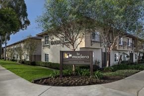 Garden Grove apartment for rent - A sign for a community named La Madera stands in front of a building.