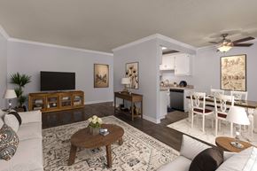 Fountain Valley apartment for rent - A living room with a white couch, a coffee table, and a television.