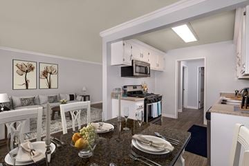 Fountain Valley apartment for rent - A modern kitchen with a breakfast table set.