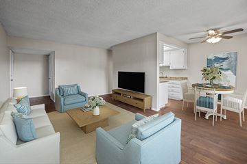 Oxnard apartment for rent - A living room with a white couch and a blue couch.
