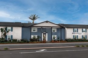 Huntington Beach apartment for rent - The Monticello building has a white and blue facade.