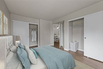 Redlands apartment for rent - A bedroom with a bed and a lamp.