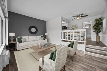 Santee apartment for rent - A living room with a white couch and a wooden coffee table.