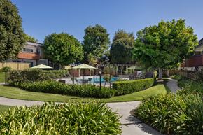 Upland apartment for rent - A residential area with a pool and greenery.