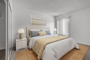Upland apartment for rent - A bedroom with a large bed and a painting above it.