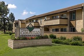Camarillo apartment for rent - A sign for Villa Camarillo Apartments is in front of a tan building.