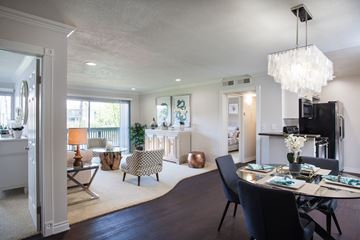 Huntington Beach apartment for rent - A modern dining room with a large table and chairs.