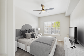 Arlington apartment for rent - A bedroom with a large bed and a television on a stand.
