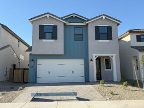 Chandler house for rent - A two-story house with a blue garage door.