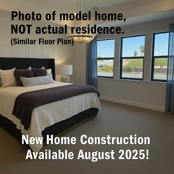 Chandler house for rent - A bedroom with a large bed and a view of the outdoors through the windows.