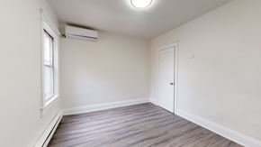 Toronto apartment for rent - A room with a window and a door is empty and waiting to be furnished.
