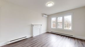 Toronto apartment for rent - A room with a fireplace and a window.