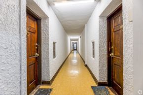 Toronto apartment for rent - A long hallway with doors on both sides.