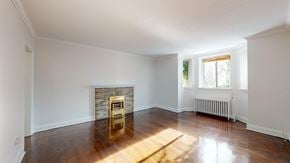 Toronto apartment for rent - A room with a fireplace and a window.