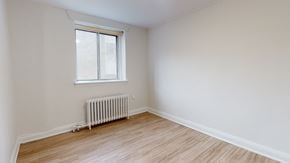 Toronto apartment for rent - A room with a window and a radiator on the floor.