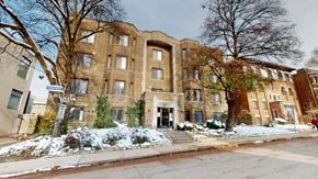 Toronto apartment for rent - A large brick building with a tree in front of it.