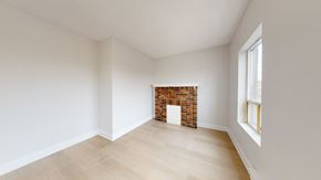 Toronto apartment for rent - A room with a fireplace and a window.