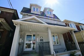 Toronto apartment for rent - A house with a sunny sky above it.
