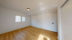 Toronto apartment for rent - A room with wooden flooring and a window.