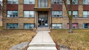 Toronto apartment for rent - A building with a tree in front of it.