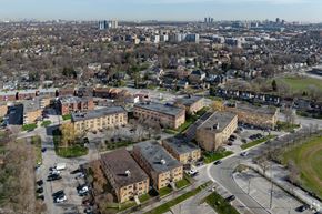 Toronto apartment for rent - A cityscape with buildings and roads.