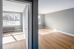 Toronto apartment for rent - A room with wooden flooring and a grey wall.
