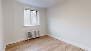 Toronto apartment for rent - A room with a window and a radiator on the floor.
