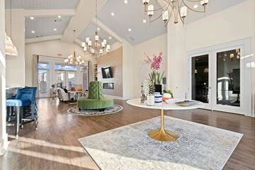 Kannapolis apartment for rent - A living room with a white table and a chandelier.