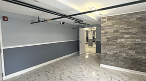 Hightstown apartment for rent - A room with a grey wall and a stone wall.