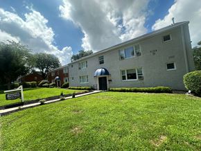 Hightstown apartment for rent - A building with a sign in front of it.