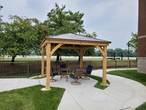 Vincennes apartment for rent - a patio with a gazebo and a table and chairs
