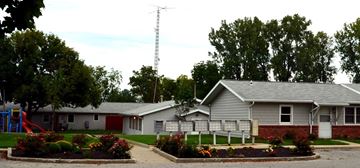 Kokomo apartment for rent - a white house with a playground in front of it