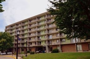 Kokomo apartment for rent - a large apartment building with a lawn in front of it