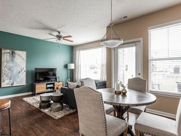Westfield apartment for rent - A living room with a grey sofa, a round table and a television.