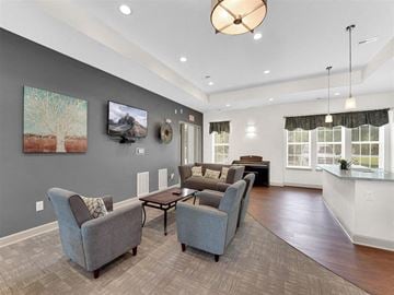 Brownsburg apartment for rent - A living room with grey couches and a wooden floor.