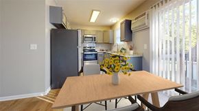 Fortville apartment for rent - A kitchen with a table and chairs in front of it at Ridgeview Apartments, Fortville 46060