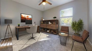 Fortville apartment for rent - A living room with a brown chair and a painting on the wall.