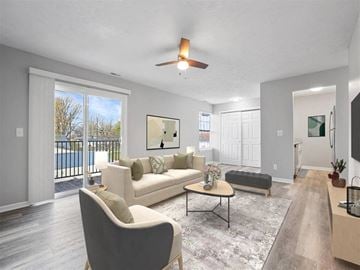 Lebanon apartment for rent - A living room with a white couch and a grey armchair.