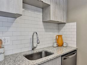 Milford apartment for rent - A kitchen with a sink and a countertop at The Reserve at Grand Valley Apartments, Milford