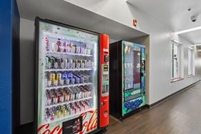 Palo Alto apartment for rent - A Coca-Cola vending machine is in a hallway.