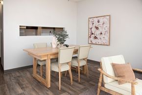 St. Paul apartment for rent - a dining room with a wooden table and chairs