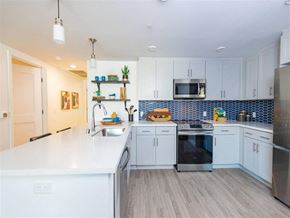 Chula Vista apartment for rent - A kitchen with white cabinets and a white countertop.
